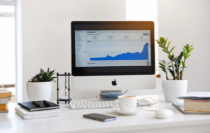 desktop computer on desk displaying analytics information